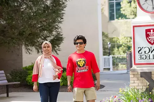 diverse students walking in Monarch Court